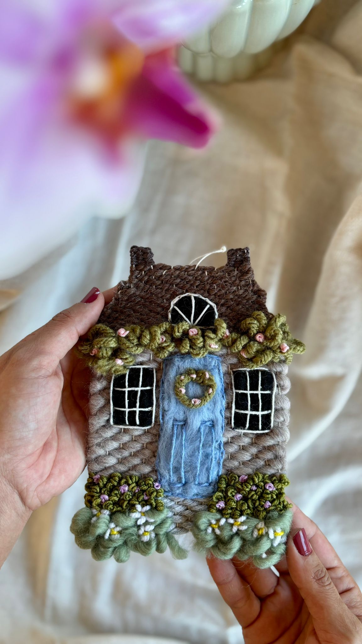 Grey cottage with daisies