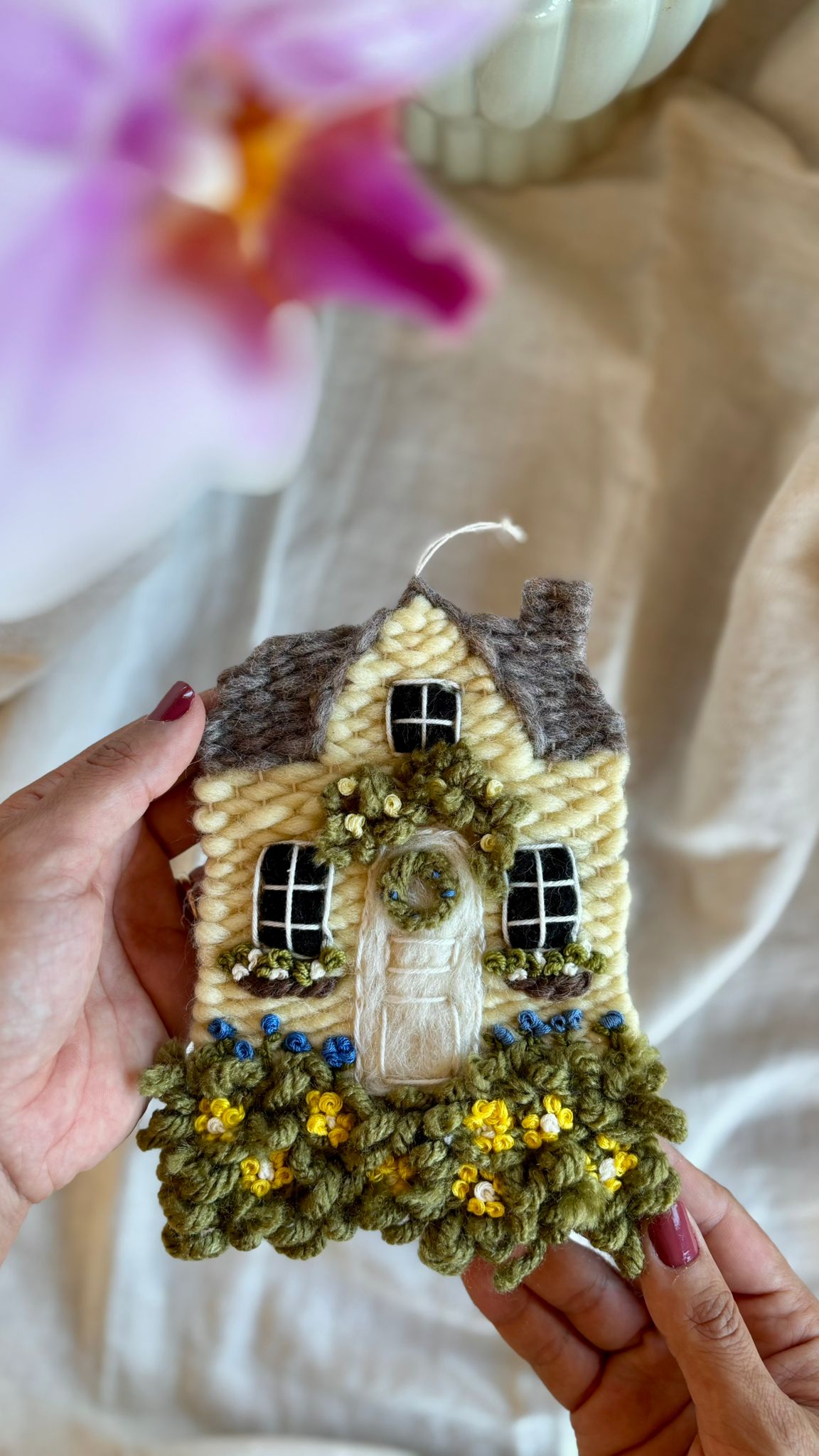 Yellow cottage with daisies