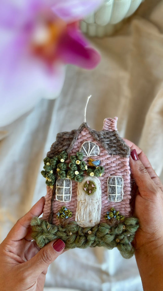 Pink cottage with bird