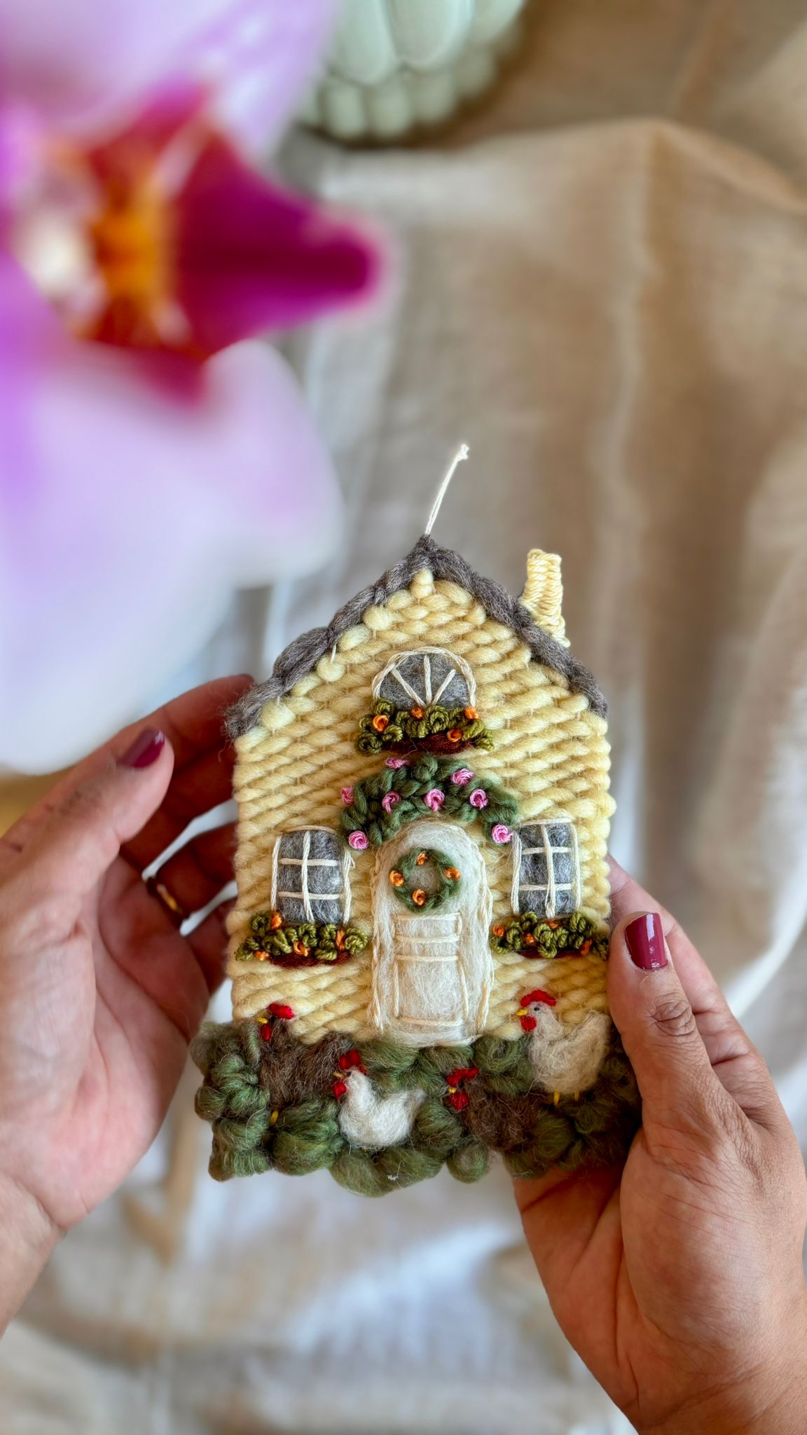 Yellow cottage with chickens