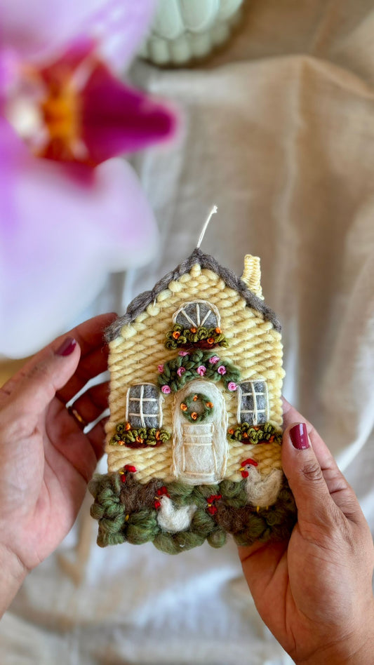 Yellow cottage with chickens
