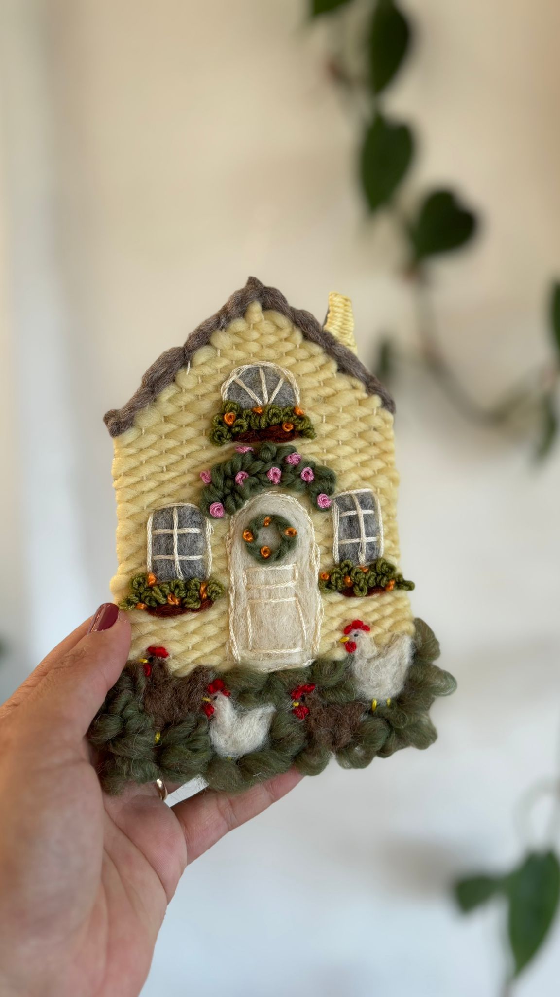 Yellow cottage with chickens
