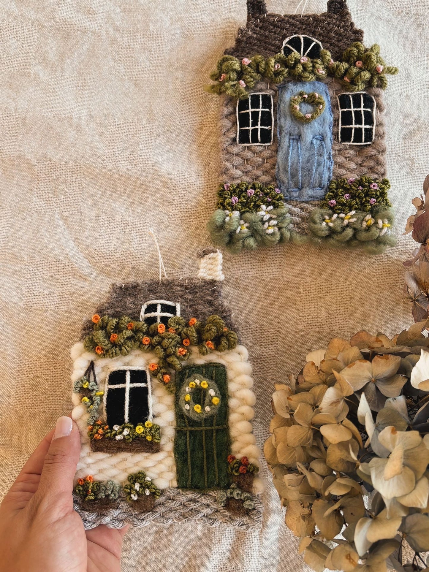Grey cottage with daisies