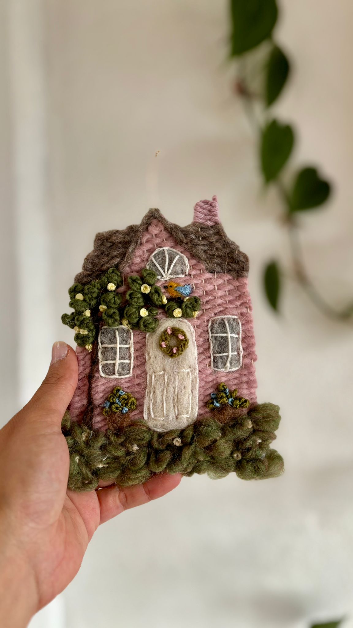 Pink cottage with bird