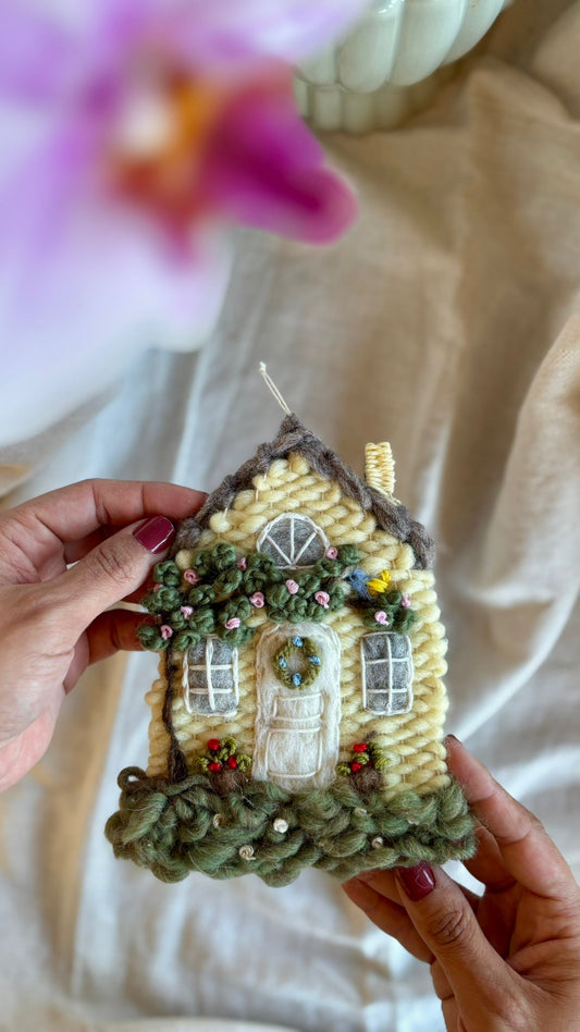 Yellow cottage with bird