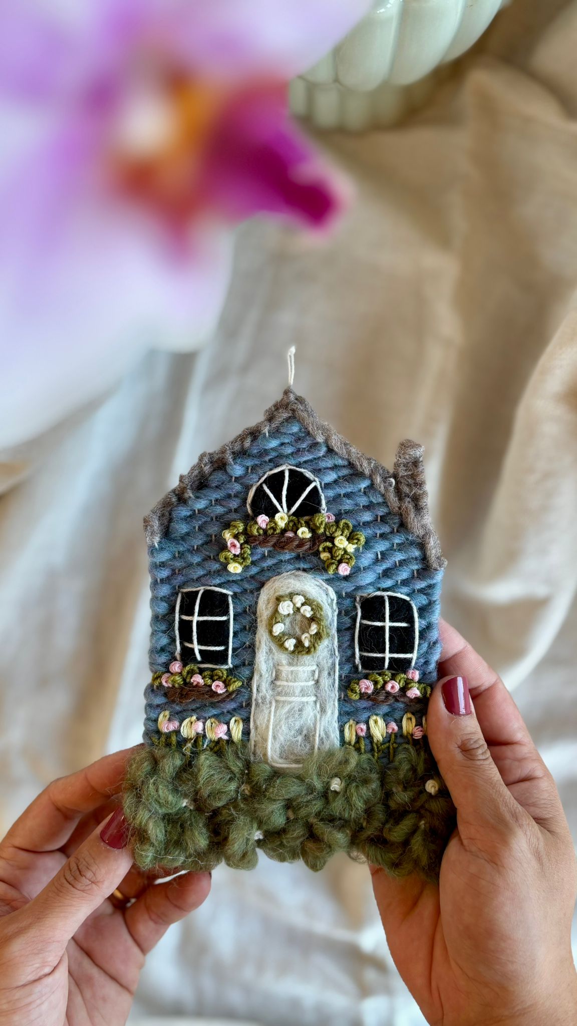 Blue cottage with tulips
