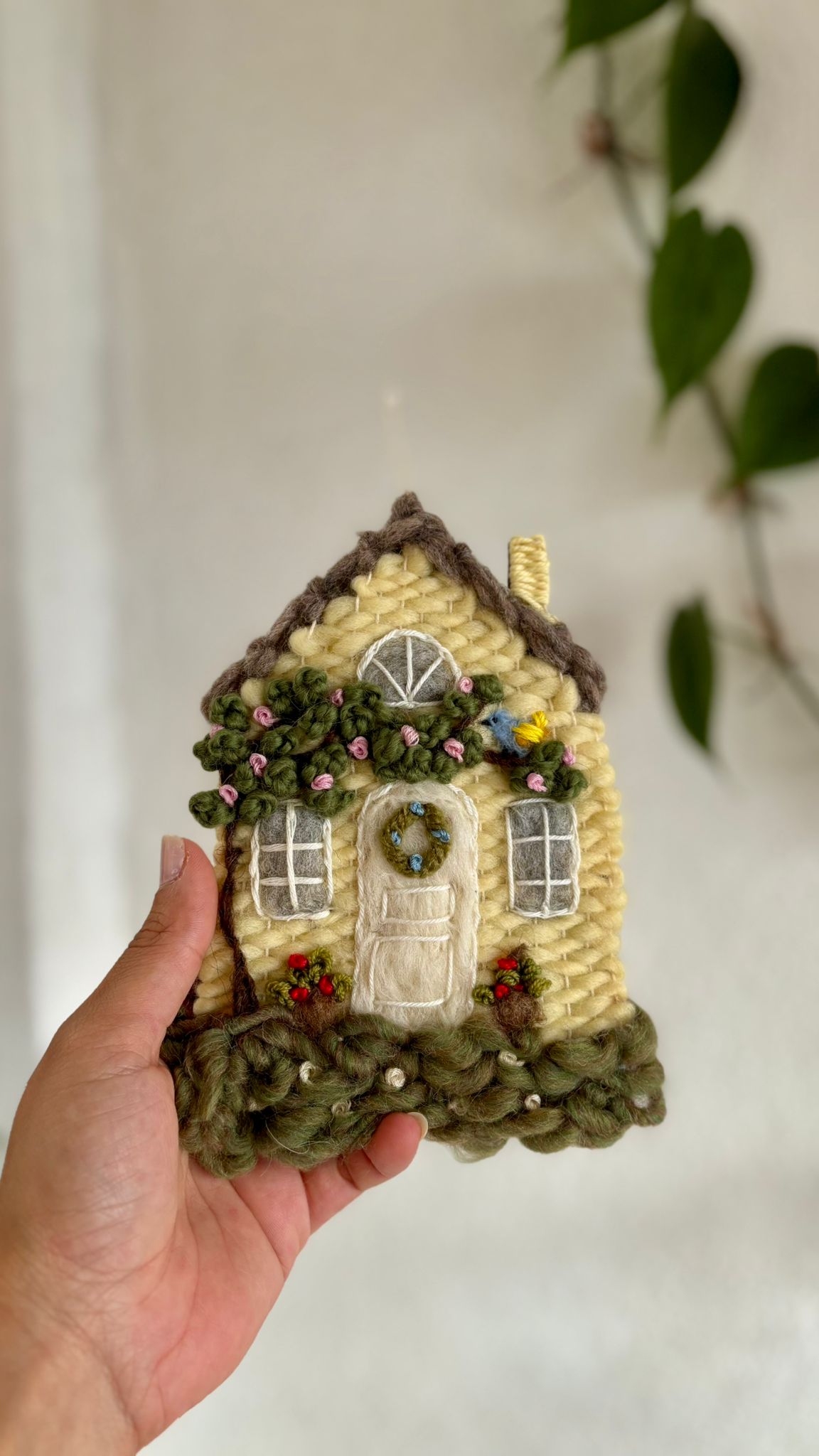 Yellow cottage with bird